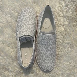 Michael Kors Keaton Slip On. Bright White. Never worn. Too big for myself.